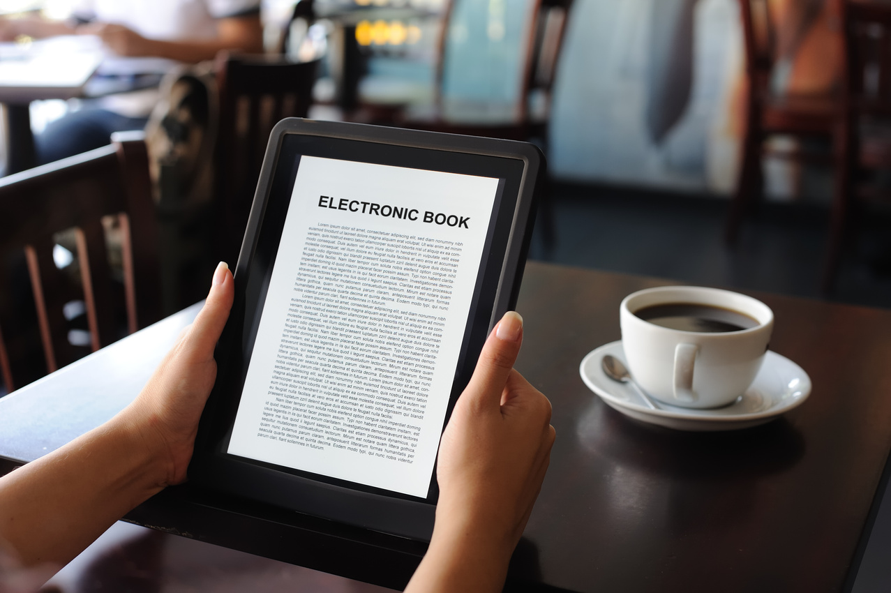 reading E-book on digital tablet